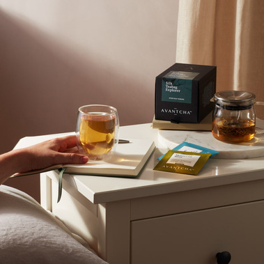 Evening cup of tea on a bedside table, food and drinks photography