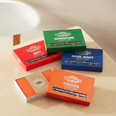 Couples-Challenge-Scratch-Off-Edition games on a birch tabletop