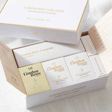 Beauty product packaging, an open box on a beige linen background.
