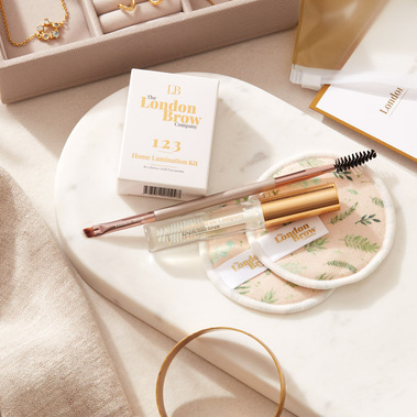 Make up product photography, brow lamination products on a dressing table