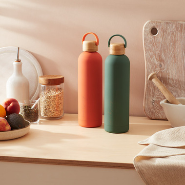 Two water bottles on a kitchen counter