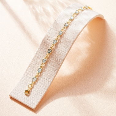 Minimalist Jewellery photographer Sally Williams UK Gold bracelet in sunlight shadows