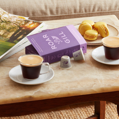 Espresso coffee with biscuits on a marble coffee table 