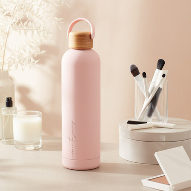 Water bottle on a dressing table in dappled sunlight