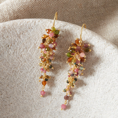 Boho gemstone earrings on a grey stone jewellery box