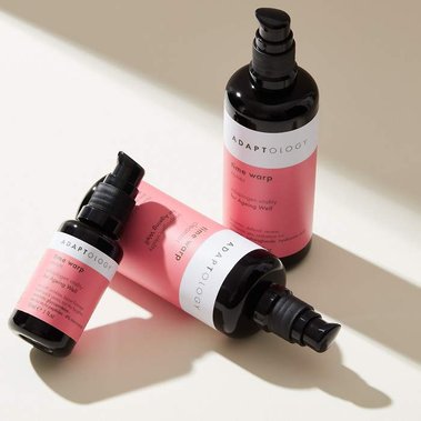 Product photographer UK, skincare bottles in daylight with long shadows on a beige background