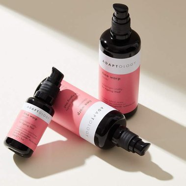 Skincare photography in a minimalist style bottles in shaft of daylight