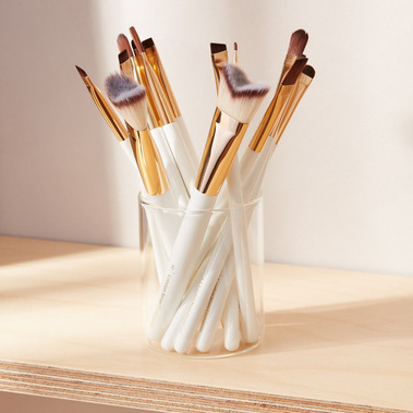 Lifestyle beauty product photography of cosmetics brushes on a shelf