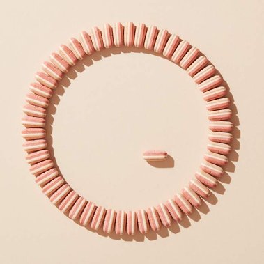 Lifestyle product photography uk. Food supplement tablets in geometric patterns minimalist styling