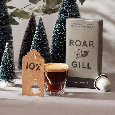 Christmas product photography for coffee capsules with mini Christmas trees