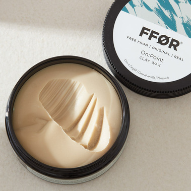 Hair product scooped out of pot