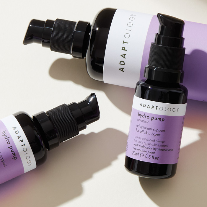 Product photography by Sally Williams, minimalist style bottles in a shaft of daylight