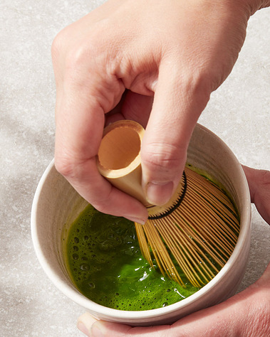 Tea product photography.  Matcha whisking in a bowl, food and drinks photography