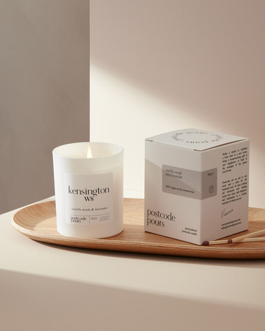 Lifestyle candle photography with shadows on a neutral background