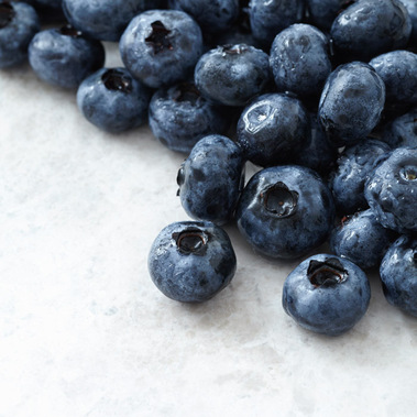 Close up of fresh blueberries on a stone background