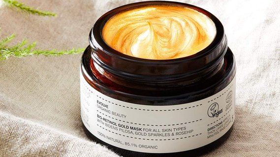 ETSY product photographer UK, a open jar of Evolve Organic skincare product on a linen background
