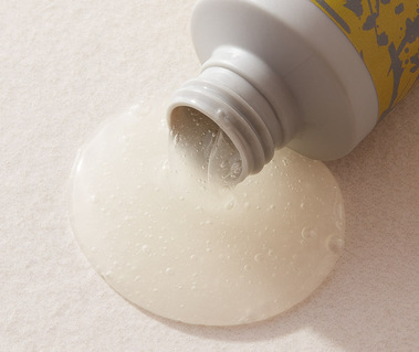 Haircare product photography of shampoo pouring out of a bottle