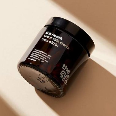 Supplements jar in a long shadow