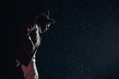 Kodak Black performing against a backdrop of rain during Rolling Loud NY 2021