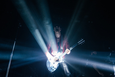 Chromeo performing at Brooklyn Steel in Brooklyn, NY. A spotlight is reflecting off of Dave 1's guitar