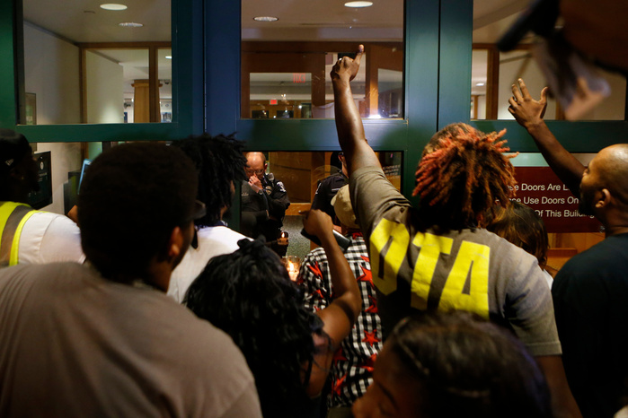 CHARLOTTE, NC - SEPTEMBER 21: Protestors surround the Charlotte Police department as residents and activists protest the death of Keith Scott September 21, 2016 in Charlotte, North Carolina. Keith was shot and killed by police officers at an apartment c