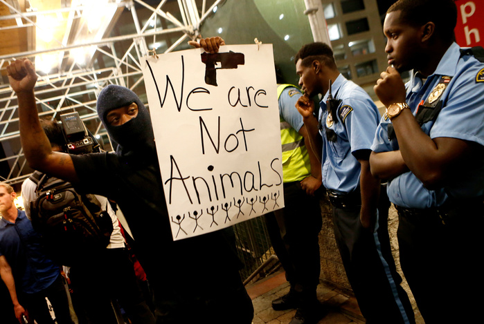 CHARLOTTE, NC - SEPTEMBER 21: Protestors march to protest the death of Keith Scott September 21, 2016 in Charlotte, North Carolina. Keith was shot and killed by police officers at an apartment complex near UNC Charlotte. (Photo by Brian Blanco/Getty Ima