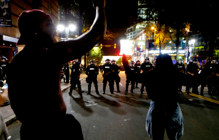 CHARLOTTE, NC - SEPTEMBER 21: Police clash with protestors as residents and activists protest the death of Keith Scott September 21, 2016 in Charlotte, North Carolina. Keith was shot and killed by police officers at an apartment complex near UNC Charlot