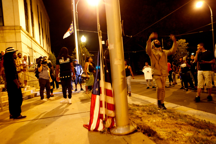 CHARLOTTE, NC - SEPTEMBER 21: Protestors surround the Charlotte Police department as residents and activists protest the death of Keith Scott September 21, 2016 in Charlotte, North Carolina. Keith was shot and killed by police officers at an apartment c