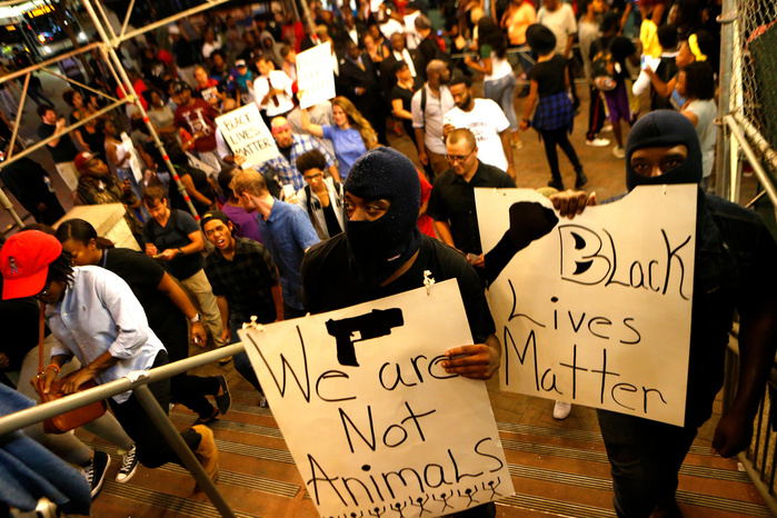 CHARLOTTE, NC - SEPTEMBER 21: Police clash with protestors as residents and activists protest the death of Keith Scott September 21, 2016 in Charlotte, North Carolina. Keith was shot and killed by police officers at an apartment complex near UNC Charlot
