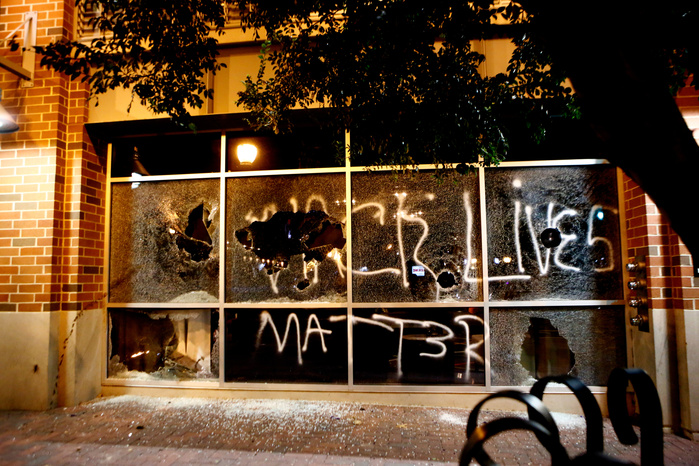 CHARLOTTE, NC - SEPTEMBER 21: Police clash with protestors as residents and activists protest the death of Keith Scott September 21, 2016 in Charlotte, North Carolina. Keith was shot and killed by police officers at an apartment complex near UNC Charlot