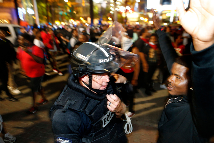 CHARLOTTE, NC - SEPTEMBER 21: Protestors march to protest the death of Keith Scott September 21, 2016 in Charlotte, North Carolina. Keith was shot and killed by police officers at an apartment complex near UNC Charlotte. (Photo by Brian Blanco/Getty Ima