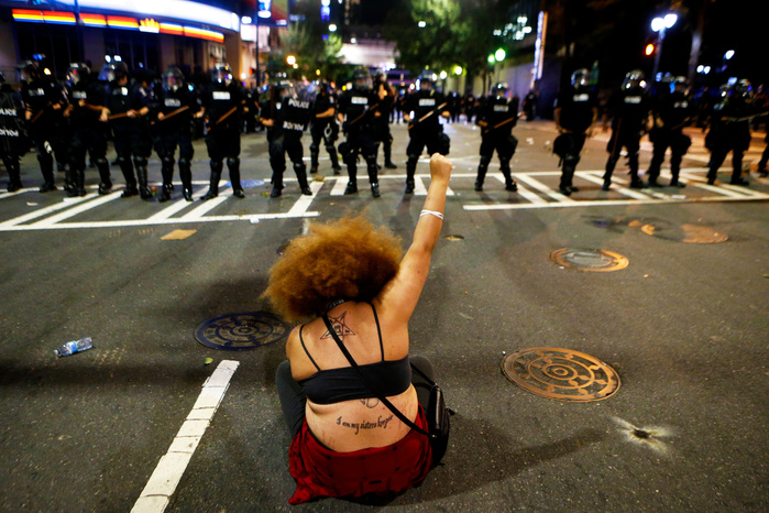 CHARLOTTE, NC - SEPTEMBER 21: Police clash with protestors as residents and activists protest the death of Keith Scott September 21, 2016 in Charlotte, North Carolina. Keith was shot and killed by police officers at an apartment complex near UNC Charlot