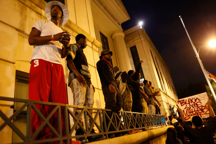 CHARLOTTE, NC - SEPTEMBER 21: Protestors surround the Charlotte Police department as residents and activists protest the death of Keith Scott September 21, 2016 in Charlotte, North Carolina. Keith was shot and killed by police officers at an apartment c