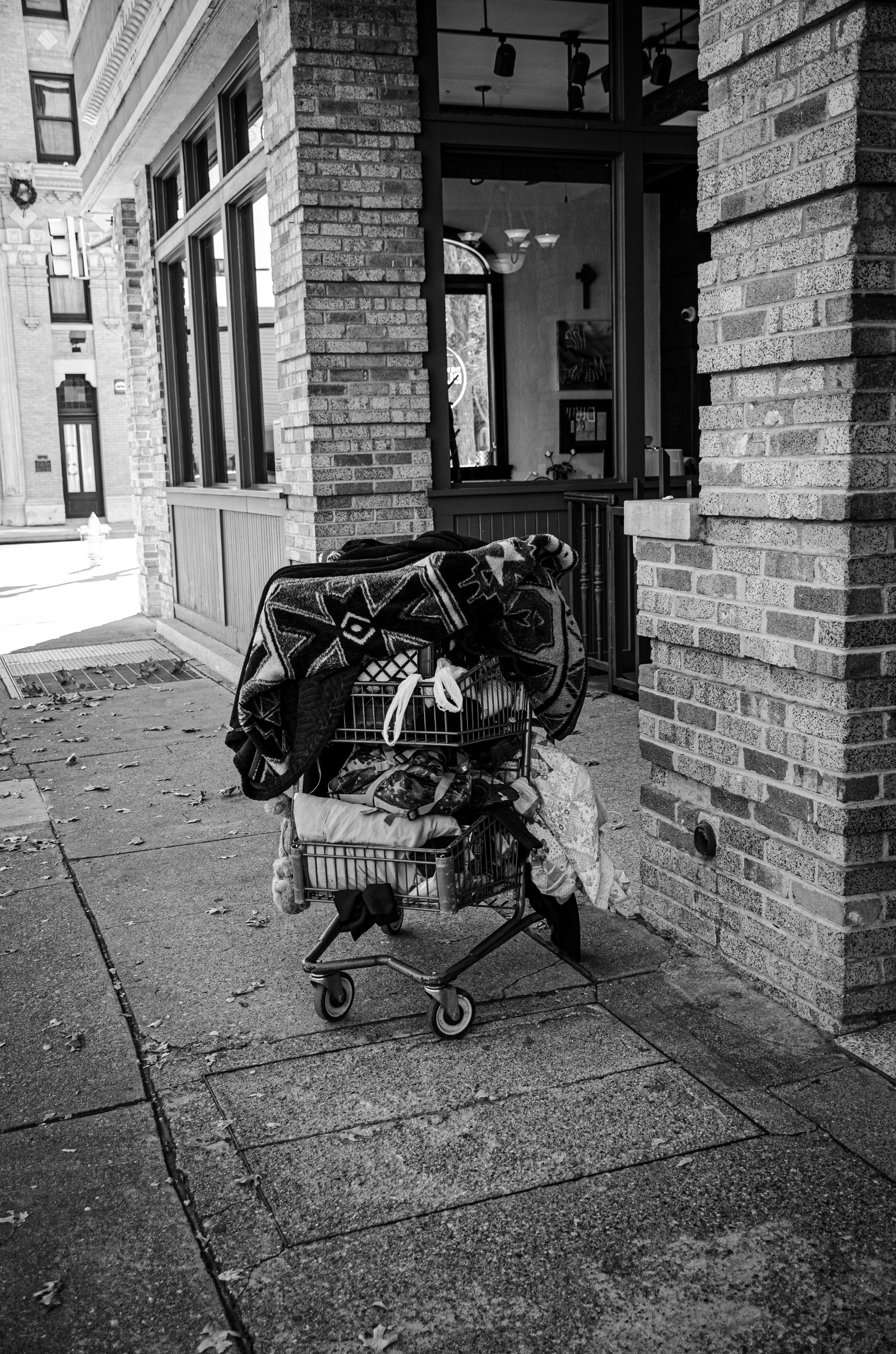 A mobile home, meticulously arranged, quietly holding its ground. Each layer tells a story—fabric, weight, and survival—stitched together in the margins of a city that moves too fast to notice.