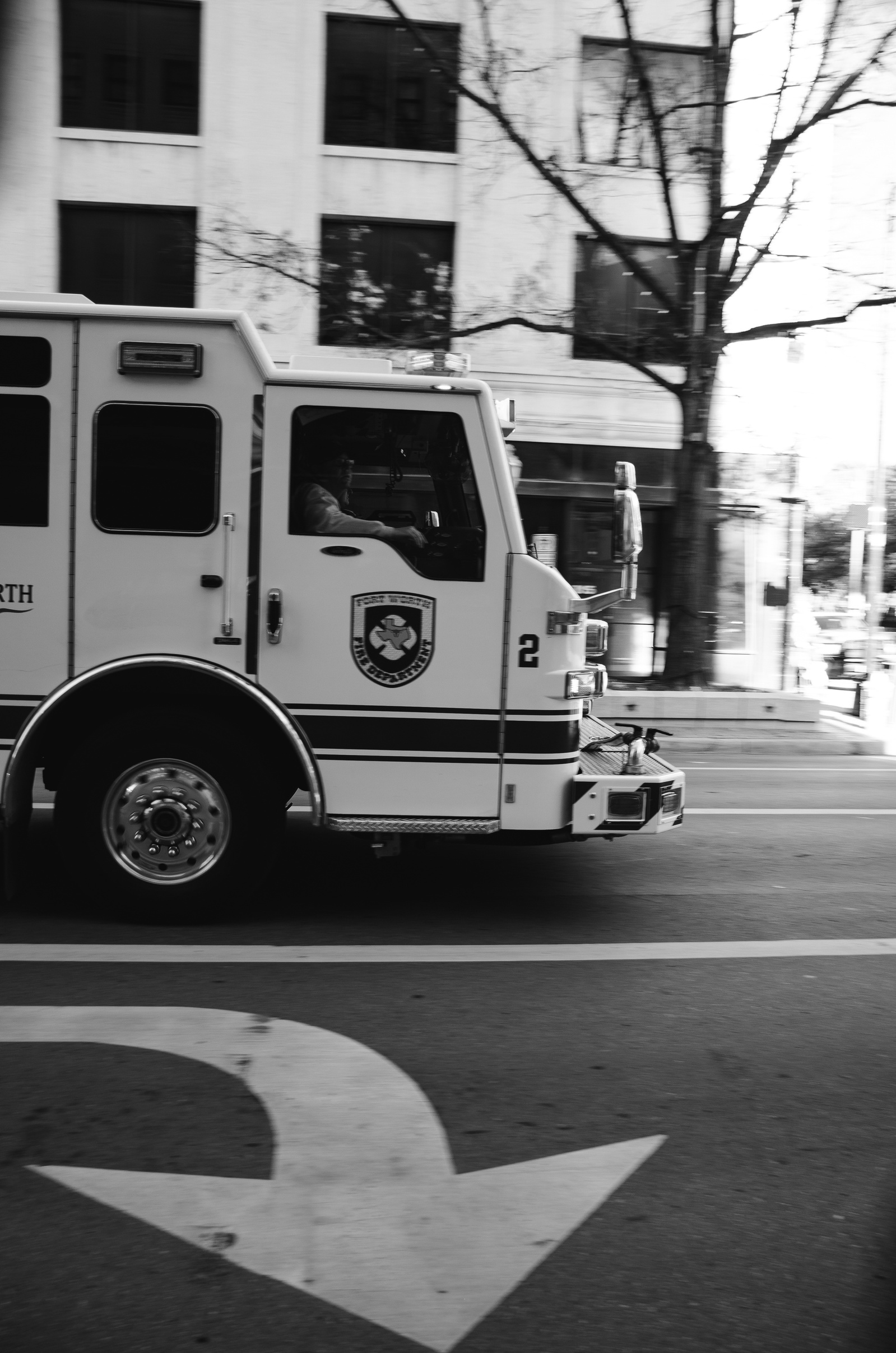 Velocity in service. The arrow points, the engine obeys. A visual echo of urgency, frozen mid-mission. This is motion made iconic—duty drawn in rubber and line.