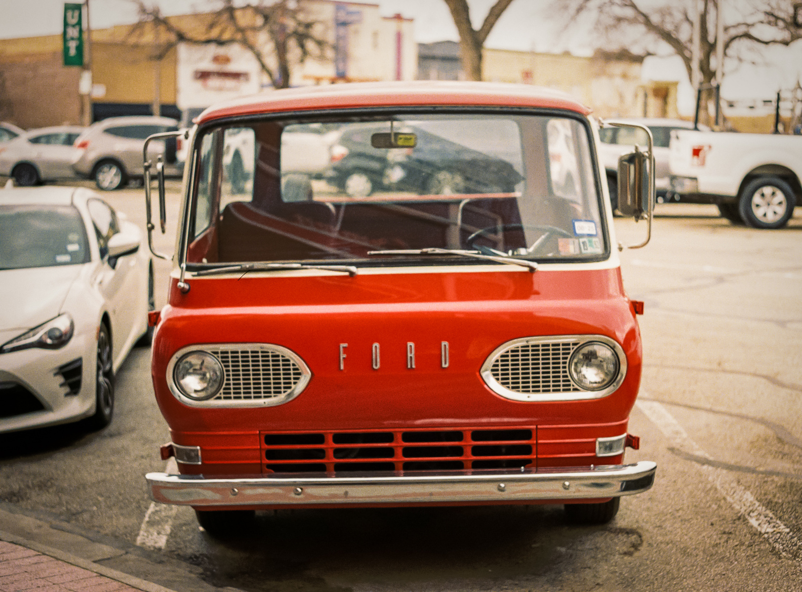 Parked but far from idle, this vintage Ford van hums with stories. Shot in front of UNT’s downtown outposts, it’s a portrait of memory, machinery, and small-town muscle.