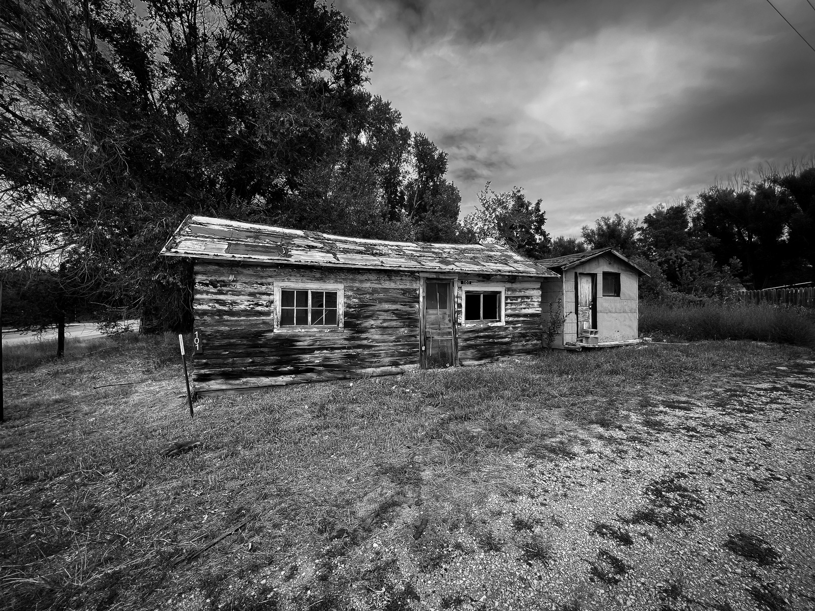 The walls remain out of habit more than strength. Time has peeled away the surface, but something of the place still lingers — a shape where warmth once lived.