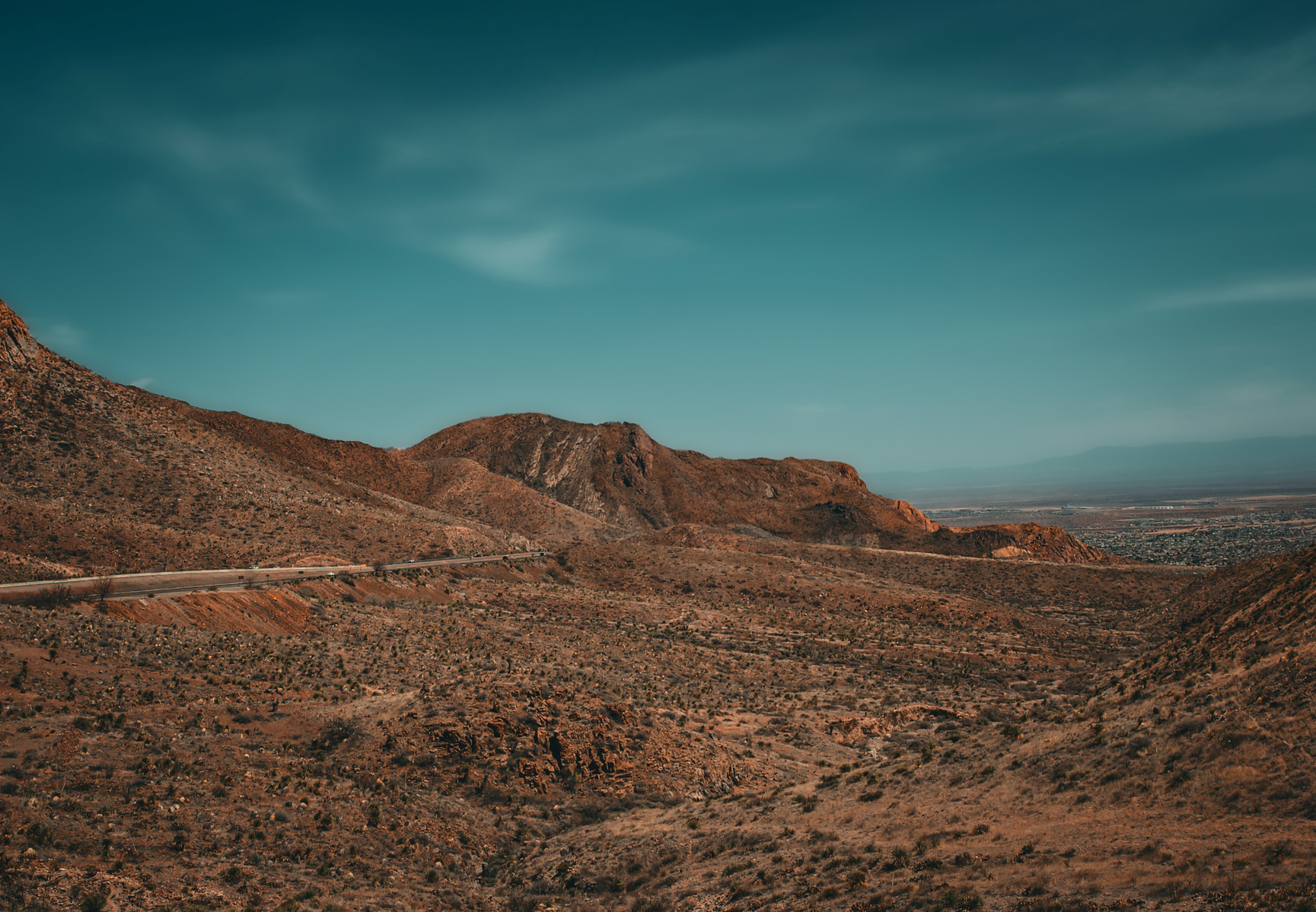 The edge of a journey, where the road slips quietly into the folds of time. Everything here is sun-worn and certain — and yet, just ahead, it fades.