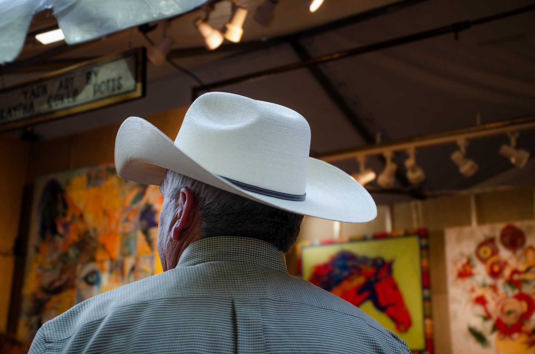 He came for the art, but the gallery found him instead. Hat first. History second.