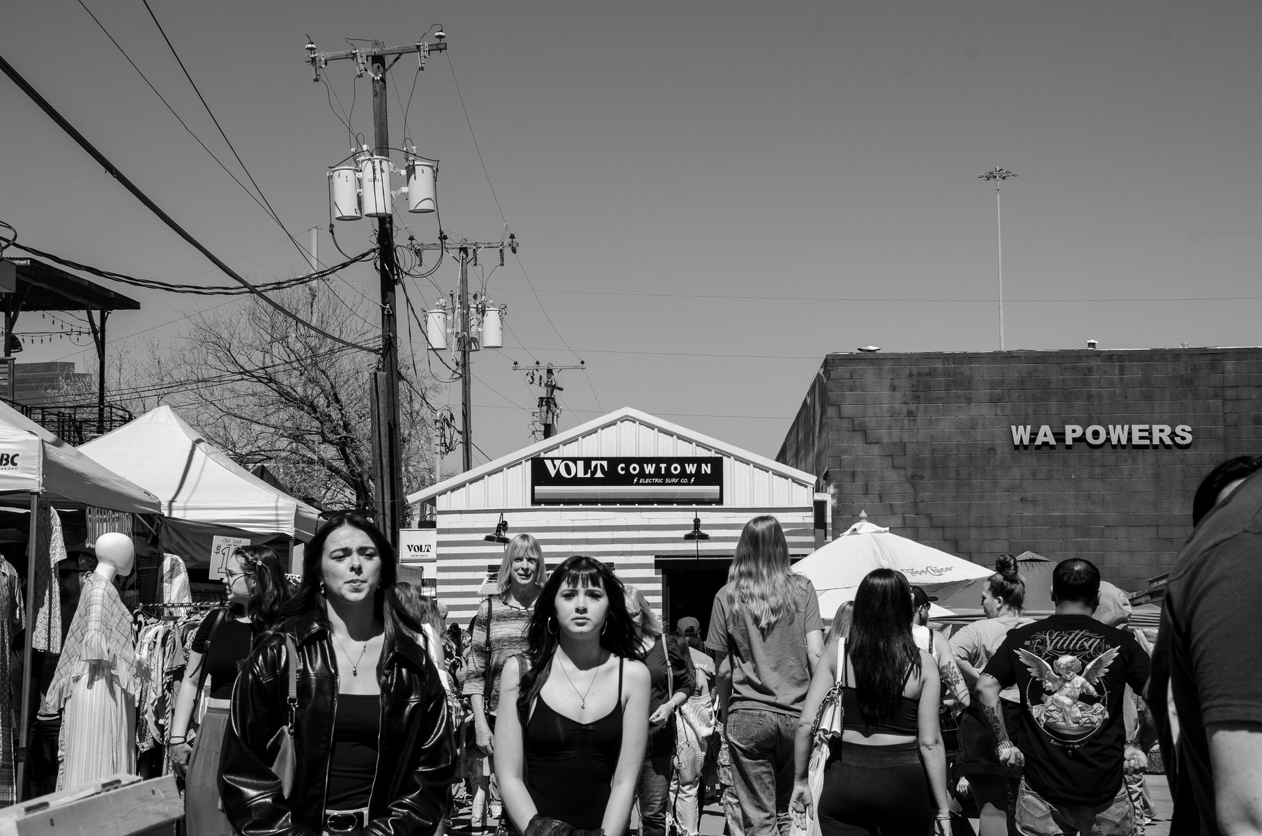 In the flood of bodies and branding, individuality surfaces like static through signal. This is the theater of the everyday—posed by no one, performed by everyone.
