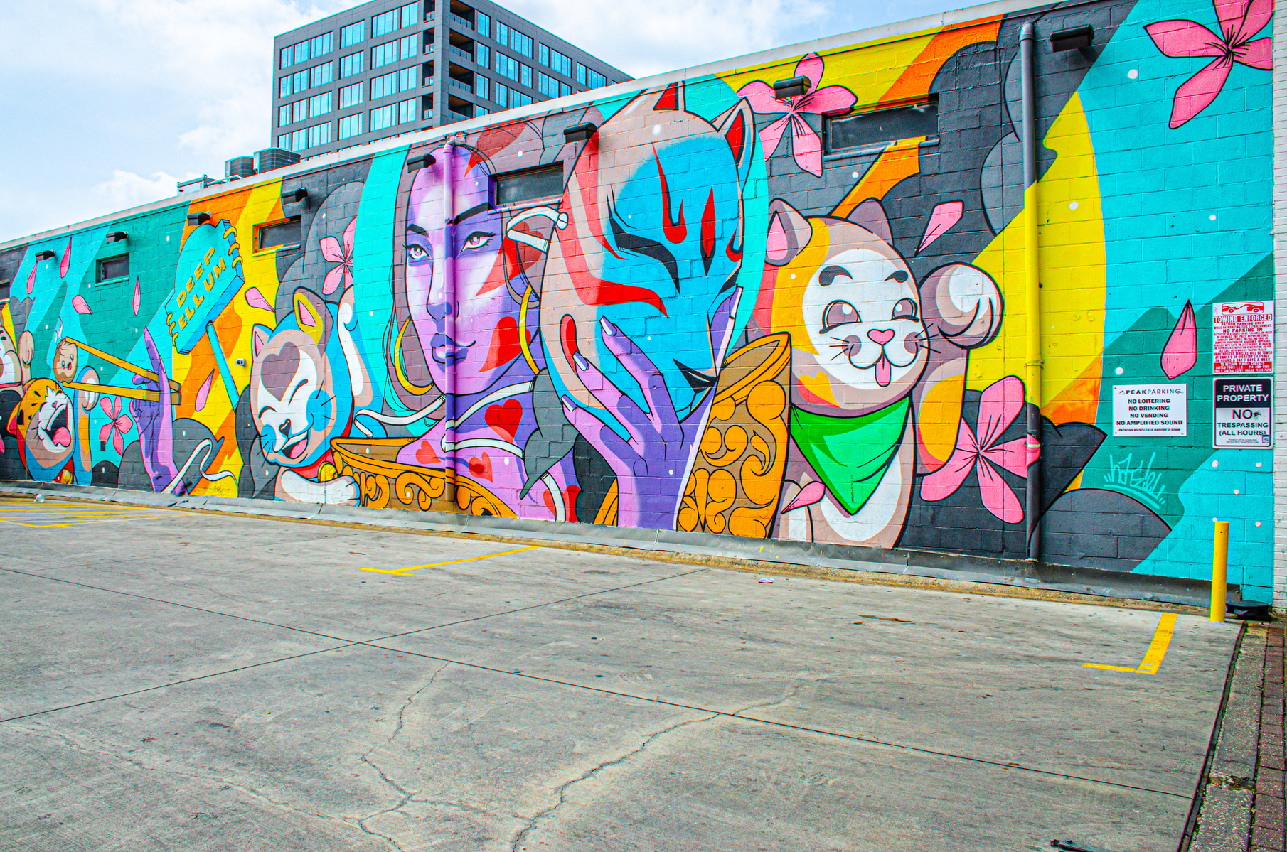 In this technicolor dream, playful cats, blossoms, and a fox mask swirl around a central figure who both reveals and hides herself. It’s a mural of dualities—joy and mystery, performance and protection—vibrating with pop energy and hidden meaning.