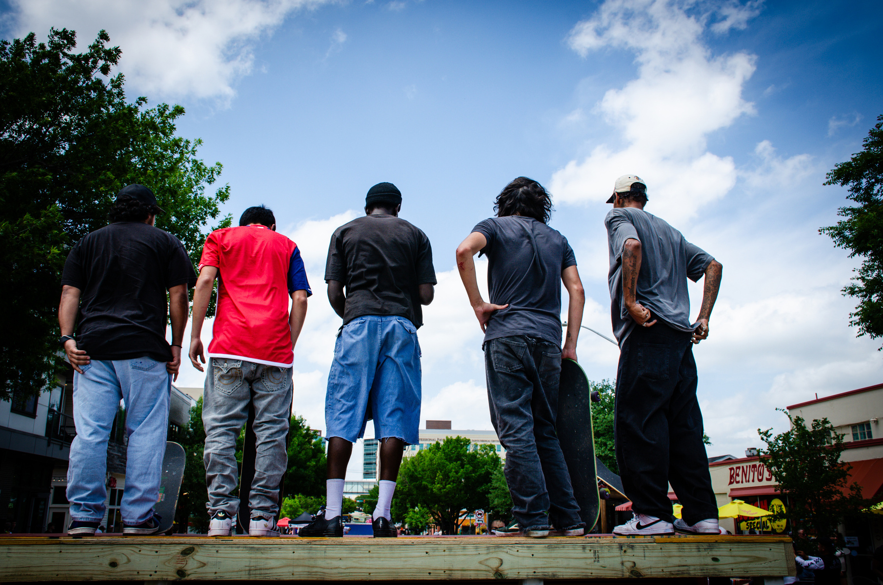 Five backs, five stances, and one shared pulse. This isn’t just about who’s next—it’s about being part of something bigger, facing the city and the trick with the same grounded defianc
