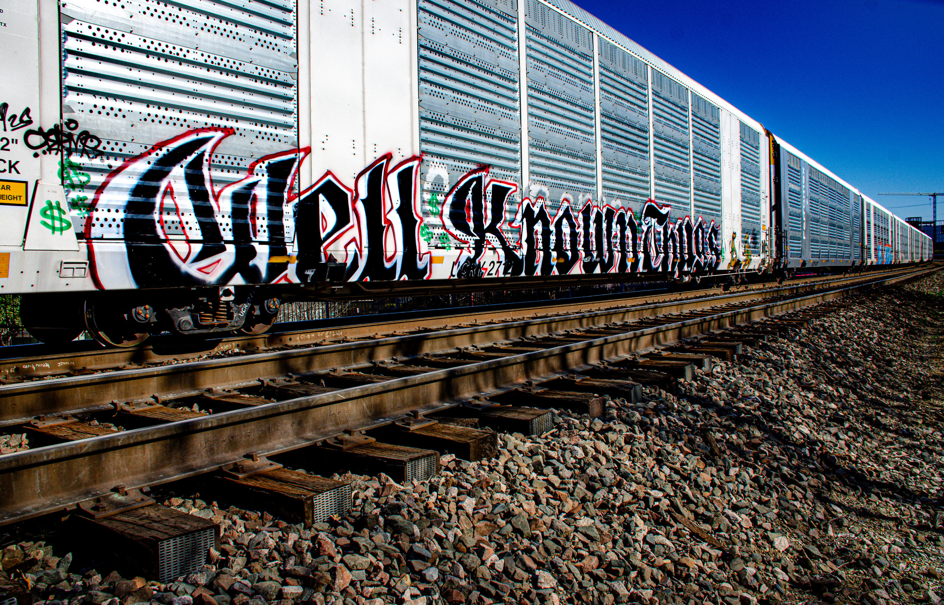 Zoomed in and loud, the graffiti reads like a proclamation across the rail line: Well Known Things. But are they? Or is this just another forgotten truth scrawled in transit?